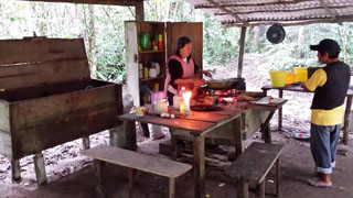 Dona Bette and Bor cooking in the historical camp kitchen of Lacandn Maya advocates Frans and Trudi Blom.