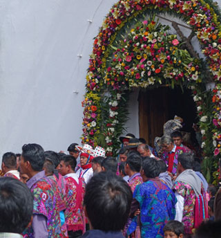 Processional leaving the Maya church in Zinacantan